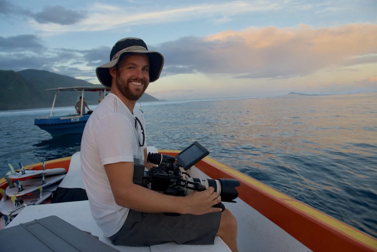 Aaron Lieber, director and cinematographer, on a boat in Tahiti with a RED cinema camera